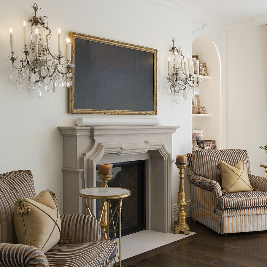 This intricately detailed master bedroom fireplace surround is the jewel of the room, finished in Grey Indiana Limestone.