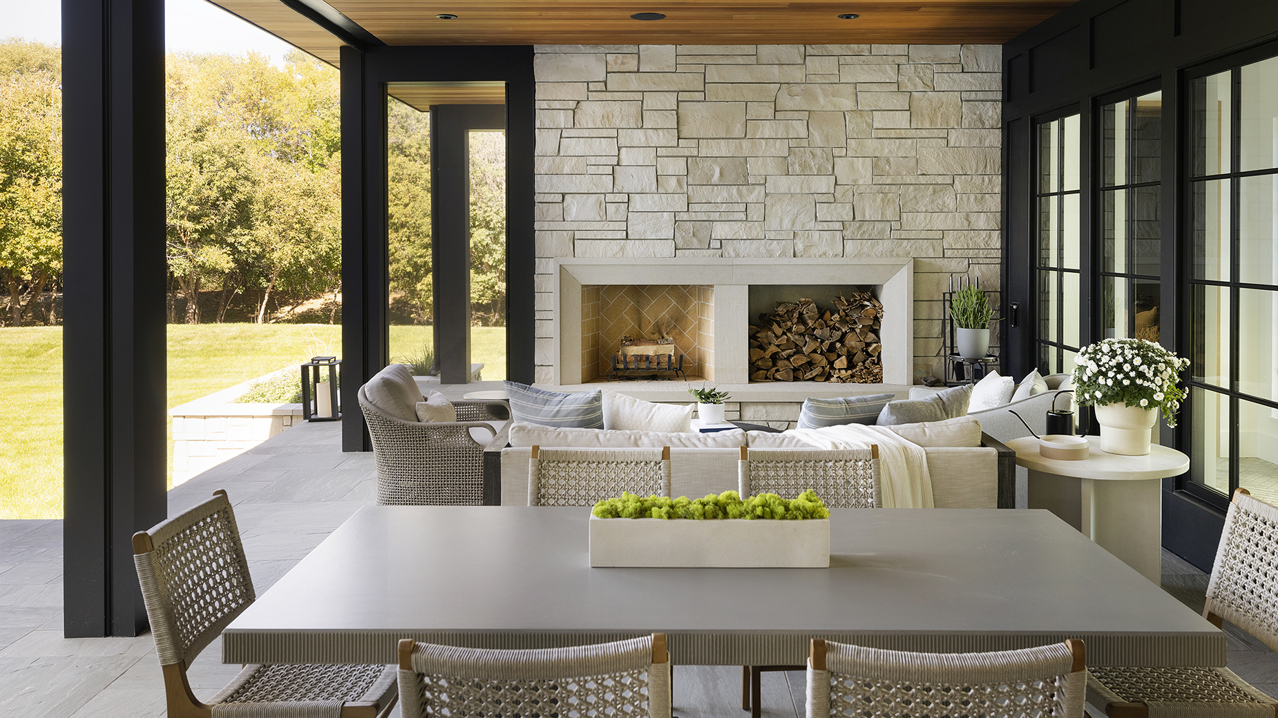 Custom fireplace surround crafted in our Gothic™ Limestone. Alder™ Limestone veneer and Hudson™ Sandstone paving coordinate beautifully.