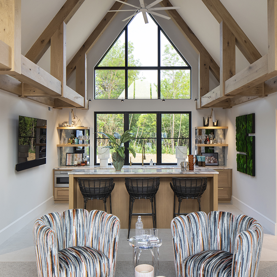 This opulent poolhouse integrates porcelain tile from the pool deck to the interior.