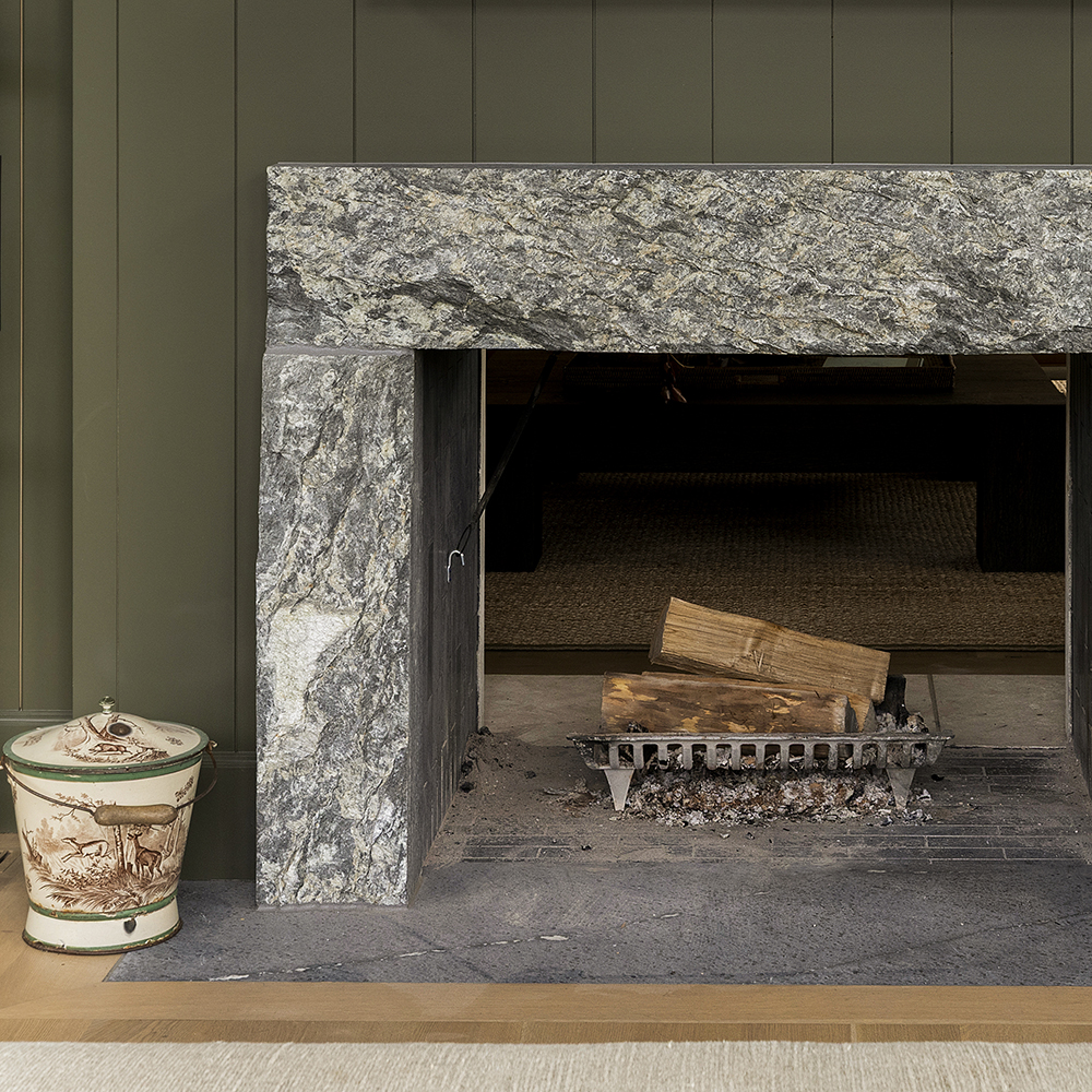 58. Custom crafted soapstone skin surround with coordinating soapstone firebricks and hearth.