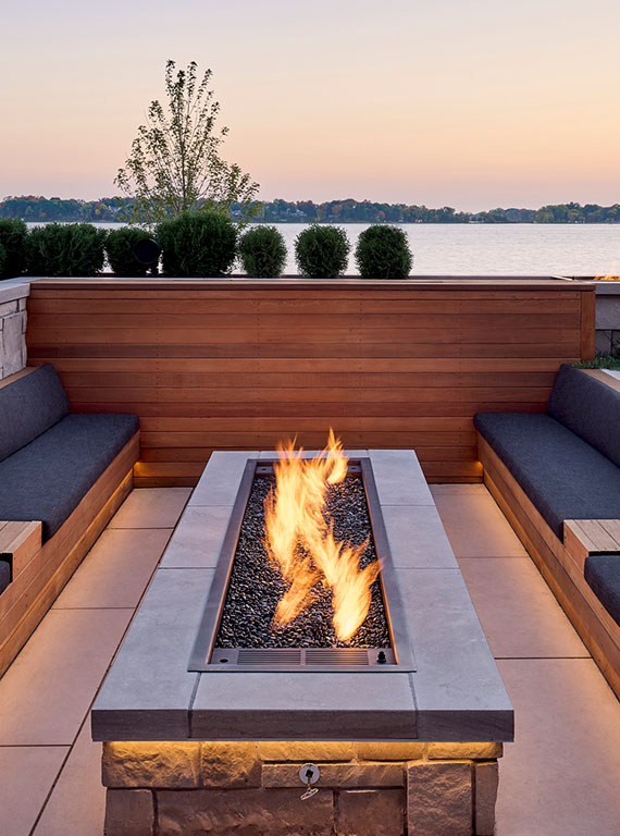 30. Barone™ Limestone in a light brush finish for the fireplace surround, Alder™ Splitface limestone veneer, and our porcelain paving in Limestone color.