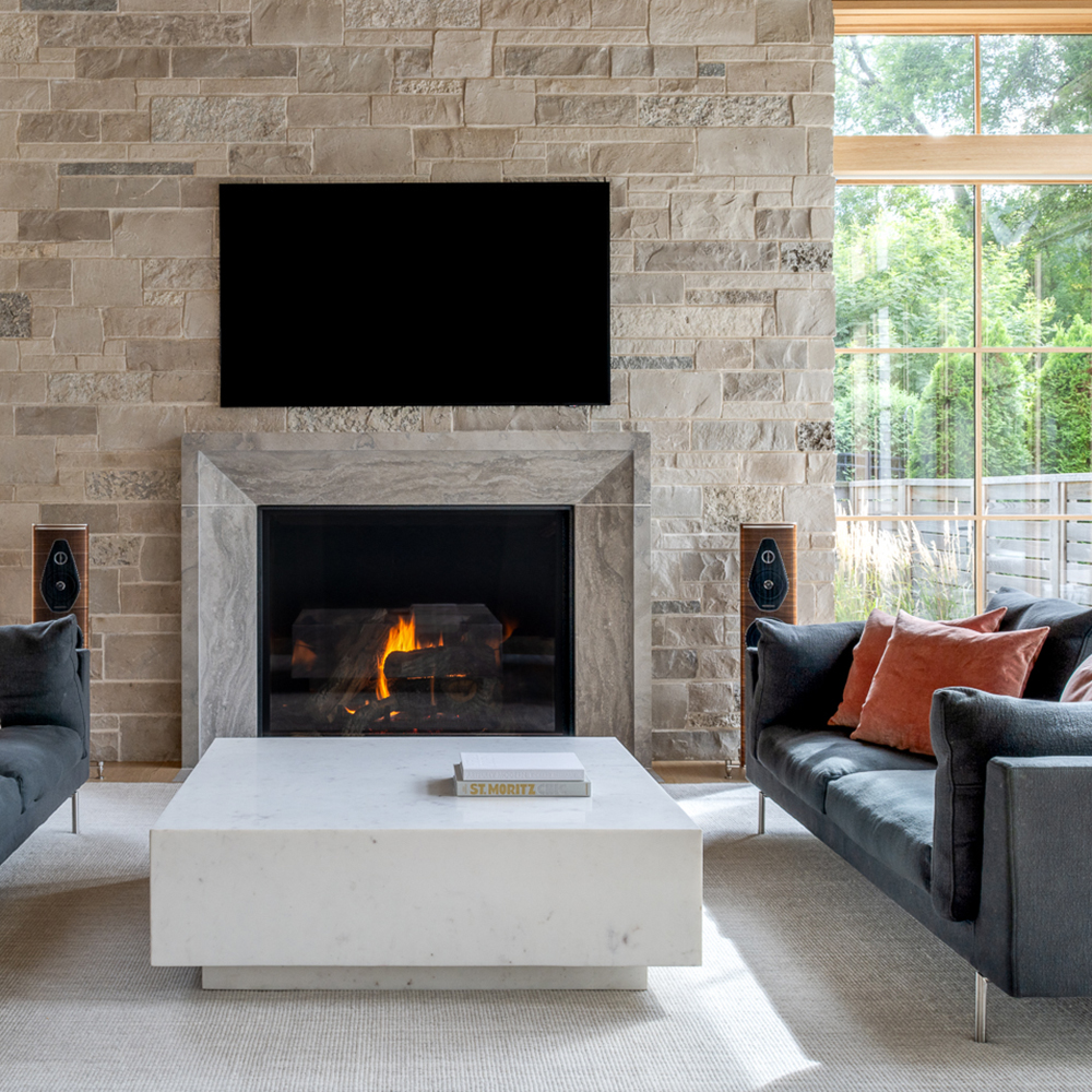 62. Barone™ Limestone custom fireplace surround with a fleuri-cut, honed, and lightly brushed finish. Custom Alder™ Limestone veneer with a blend of split face and bedface.