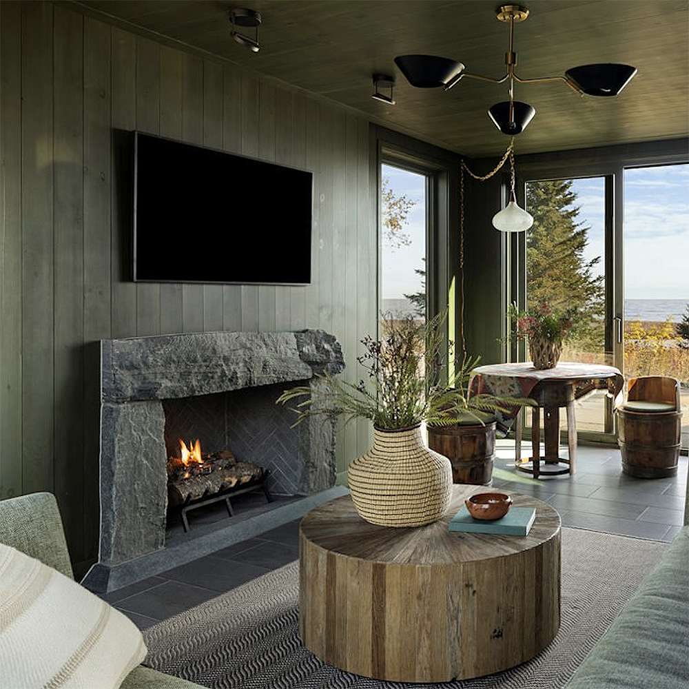 1. Hand-finished custom granite fireplace surround accentuates the organic aesthetic of this modern rustic retreat.
