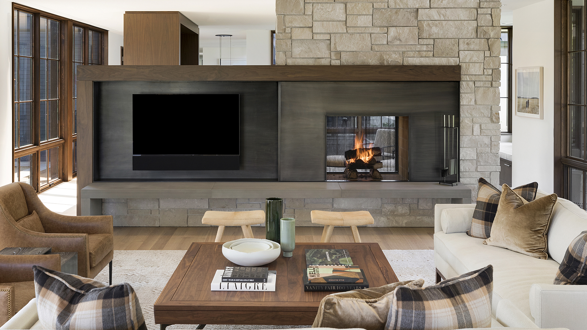 35. A bench hearth anchors this fire surround, crafted in Hudson™ Sandstone. Surrounding wall features Alder™ Limestone veneer.