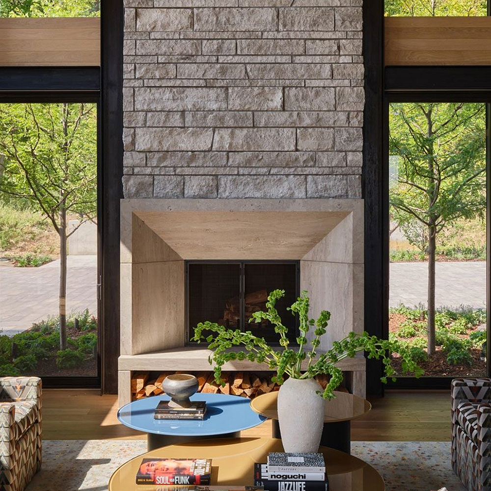 49. Barone™ Limestone custom surround, fleuri cut with a light brush finish. Alder™ Limestone Split Face Veneer features sawn heights in a coursed ashlar pattern with restoration mortar.