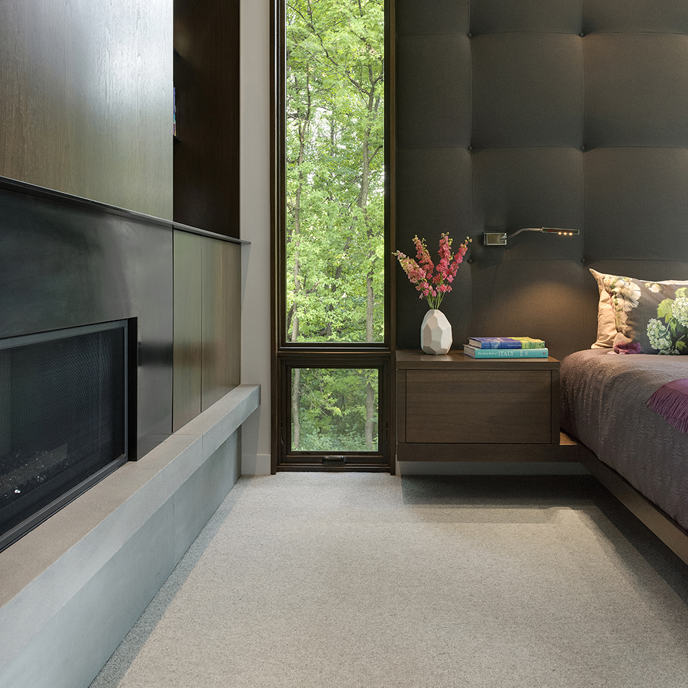 40. This bedroom suite enhanced with the stylish Bluestone Blue Select fireplace hearth.