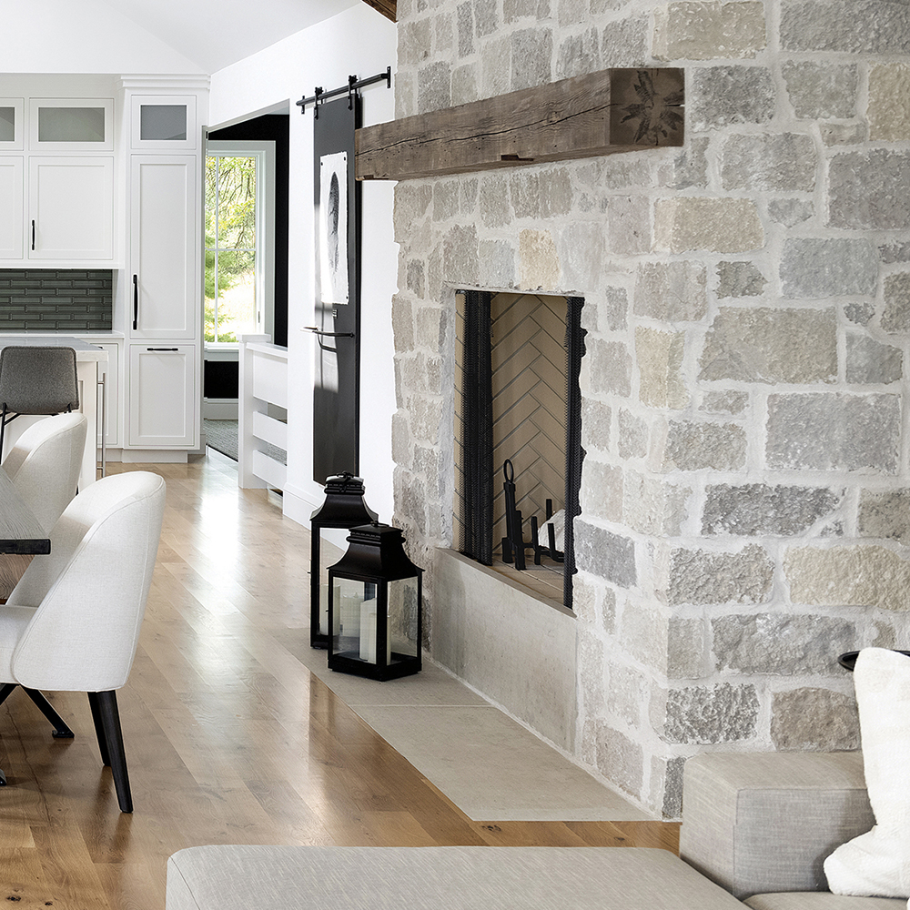 34. Lovely neutral fire surround base and hearth in Limestone surrounded by our Oyster Bay™ Limestone veneer.