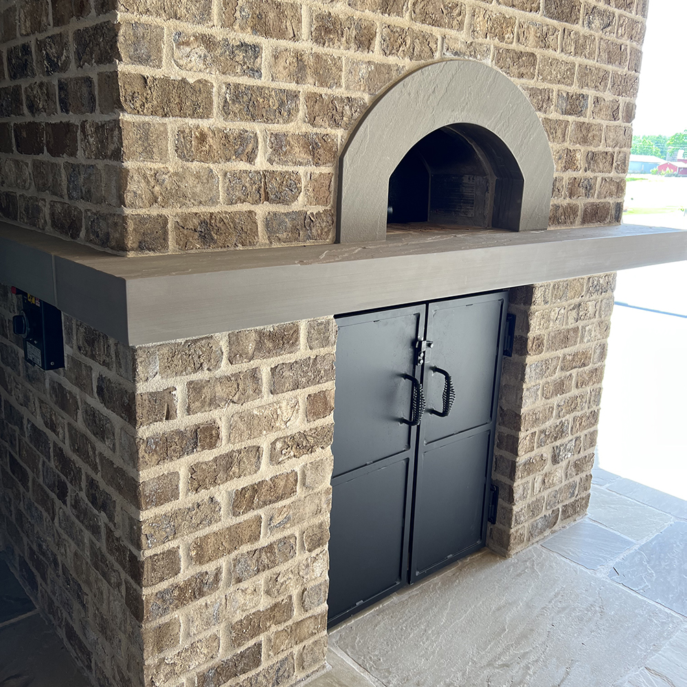 27. A poolside custom pizza oven in our Hudson™ Sandstone.